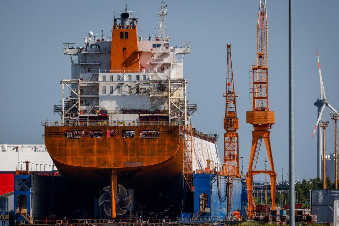 A container carrier ship sits in dry dock at the Lloyd shipyards in Bremerhaven, Germany, on June 12, 2025. Bremerhaven is the biggest German port for the automotive industry and the second largest container port in Germany, and thus a hub for a wide range of imports and exports. (Focke Strangmann/AFP via Getty Images)