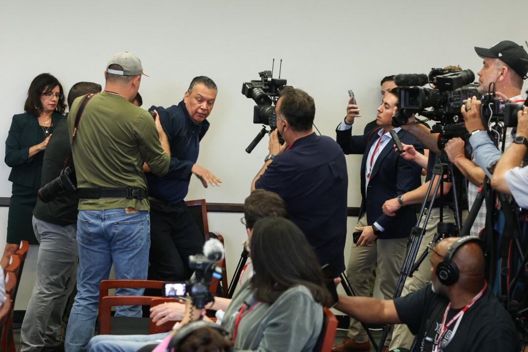 Sen. Alex Padilla (D-Calif.) is removed from a news conference with Department of Homeland Security Secretary Kristi Noem at the Wilshire Federal Building in Los Angeles on June 12, 2025. (Patrick T. Fallon/AFP via Getty Images)