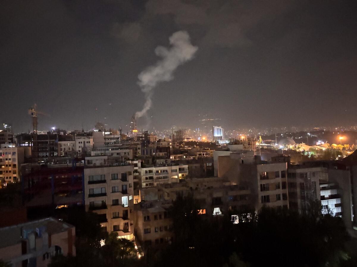 Smoke rises from a location allegedly targeted in Israel's wave of strikes on Tehran, Iran, on the early morning of June 13, 2025. (SAN/Middle East Images/AFP via Getty Images)