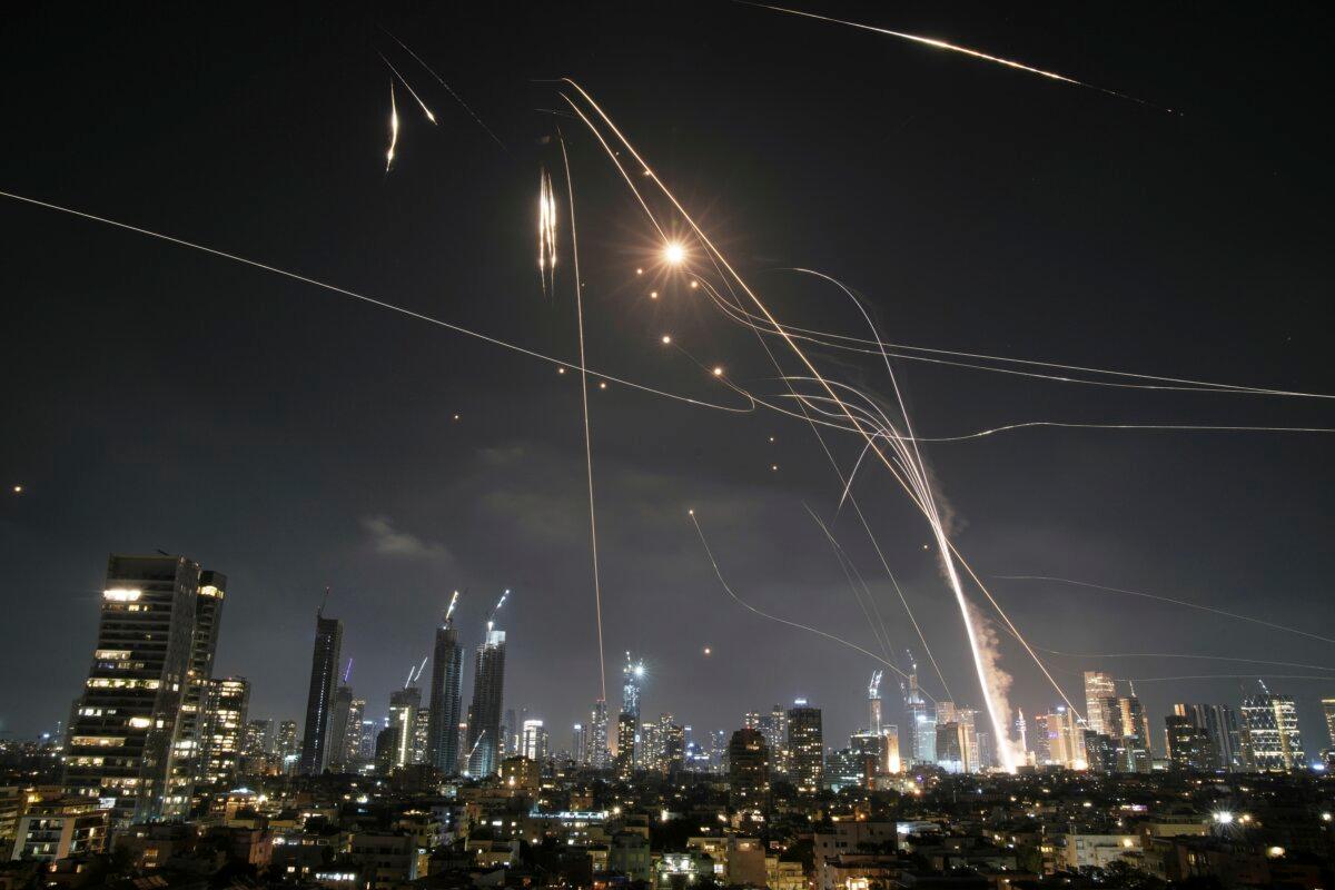 Israeli Iron Dome air defense system fires to intercept missiles over Tel Aviv, Israel, Friday, June 13, 2025. (AP Photo/Leo Correa)