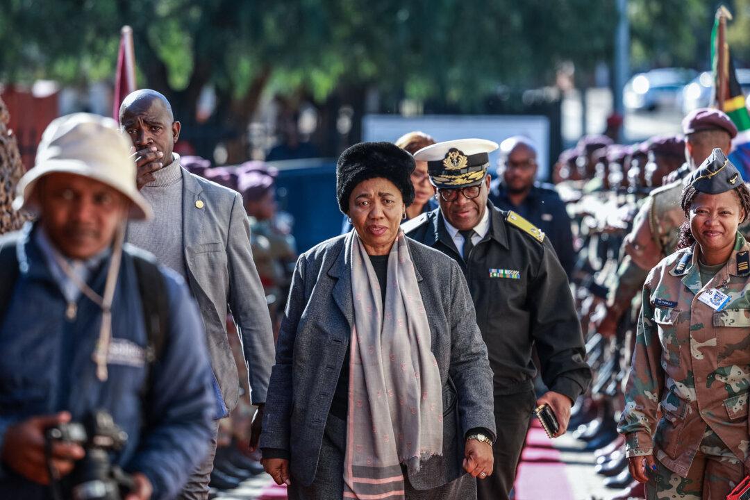 South African Minister of Defense Angie Motshekga (C) arrives for a press conference at Tembe Military Base prior to the expected arrival of South African National Defense Force soldiers following their deployment to the eastern Democratic Republic of Congo (DRC) in Bloemfontein, South Africa, on June 13, 2025. South African troops deployed in the conflict-plagued eastern DRC as part of a regional mission began withdrawing on June 12, 2025, and the first are due home on June 13, 2025, authorities said. (Phill Magakoe/AFP via Getty Images)