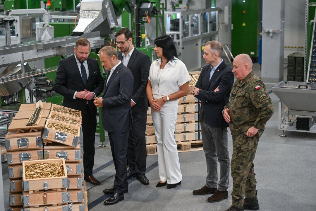 Polish Prime Minister Donald Tusk inspects small caliber ammunition during the opening of Mesko SA's New Ammunition Production Hall in Skarzysko-Kamienna, Poland, on June 13, 2025. (Omar Marques/Getty Images)