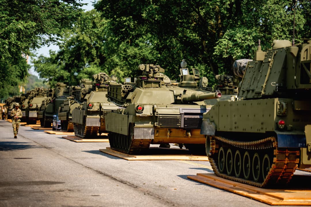 U.S. Army soldiers work on M1A3 Abrams tanks, Stryker armored vehicles, and M2 Bradley fighting vehicles at West Potomac Park along the Potomac River for weekend events marking the Army’s 250th anniversary in Washington on June 11, 2025. (Andrew Harnik/Getty Images)