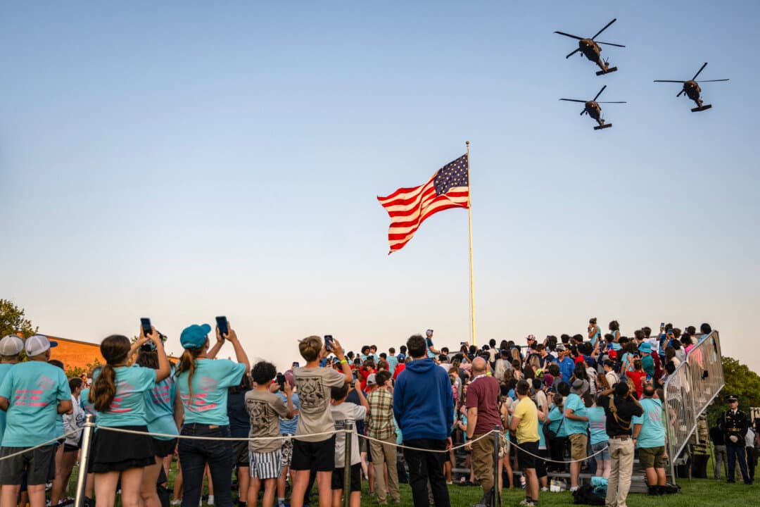 Blackhawk helicopters do a flyover at the end of the U.S. Army's Twilight Tattoo event at Joint Base Myer-Henderson Hall in Arlington, Va., on June 11, 2025. The event features soldiers from the U.S. Army Military District of Washington’s ceremonial units. (Andrew Caballero-Reynolds/AFP via Getty Images)