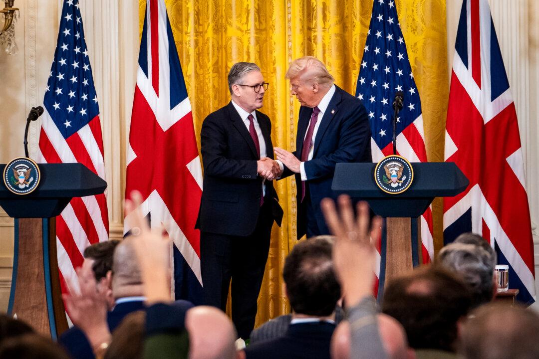 UK Prime Minister Keir Starmer and U.S. President Donald Trump shake hands after a joint press conference at the White House in Washington on Feb. 27, 2025. In May, the Trump administration reached a trade deal with the UK, granting limited U.S. market access in exchange for tariff relief on British car, steel, and aluminum exports. (Madalina Vasiliu/The Epoch Times)
