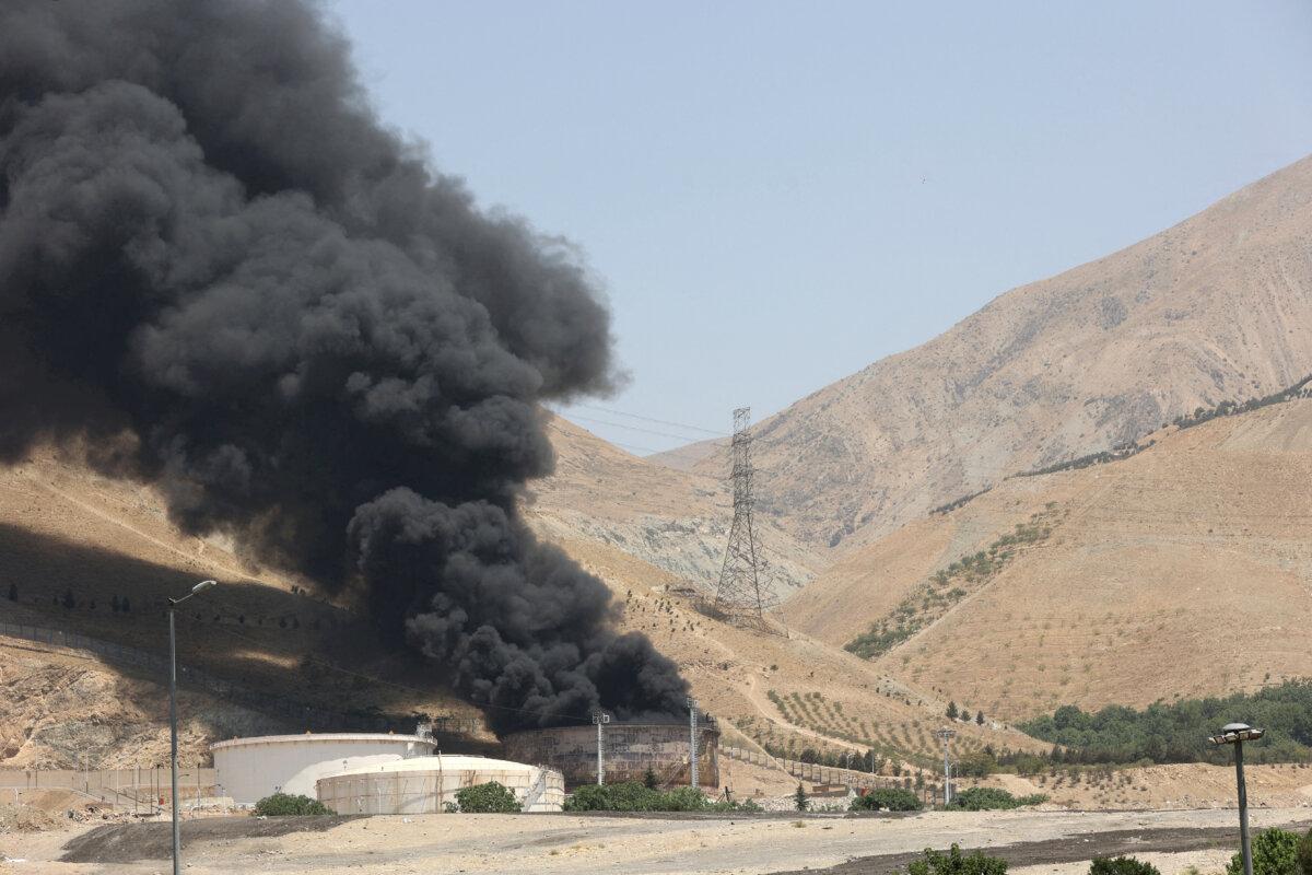Smoke rises following what Iran said was an Israeli attack on the Sharan oil depot in Tehran, Iran, on June 16, 2025. (Majid Asgaripour/WANA (West Asia News Agency) via Reuters)