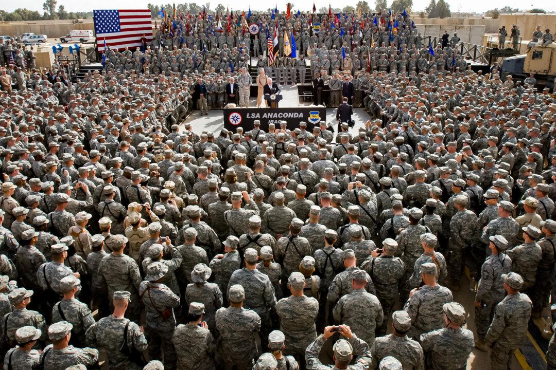 Vice President Dick Cheney (C) delivers remarks to U.S. troops stationed at Balad Air Base during an unannounced visit near Balad, Iraq, on March 18, 2008. (Paul J. Richards/AFP via Getty Images)