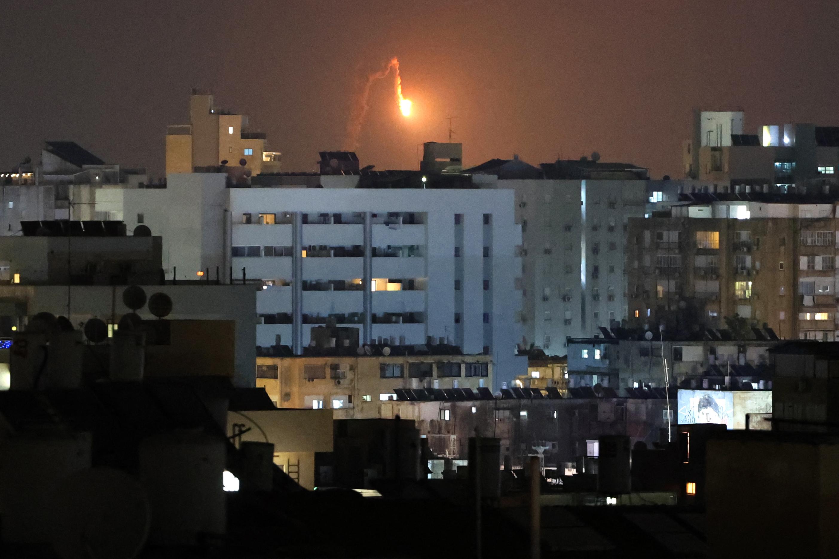 Rocket trails are seen in the sky above the Israeli coastal city of Netanya amid a fresh barrage of Iranian missile attacks on June 17, 2025. (Jack Guez/AFP via Getty Images)