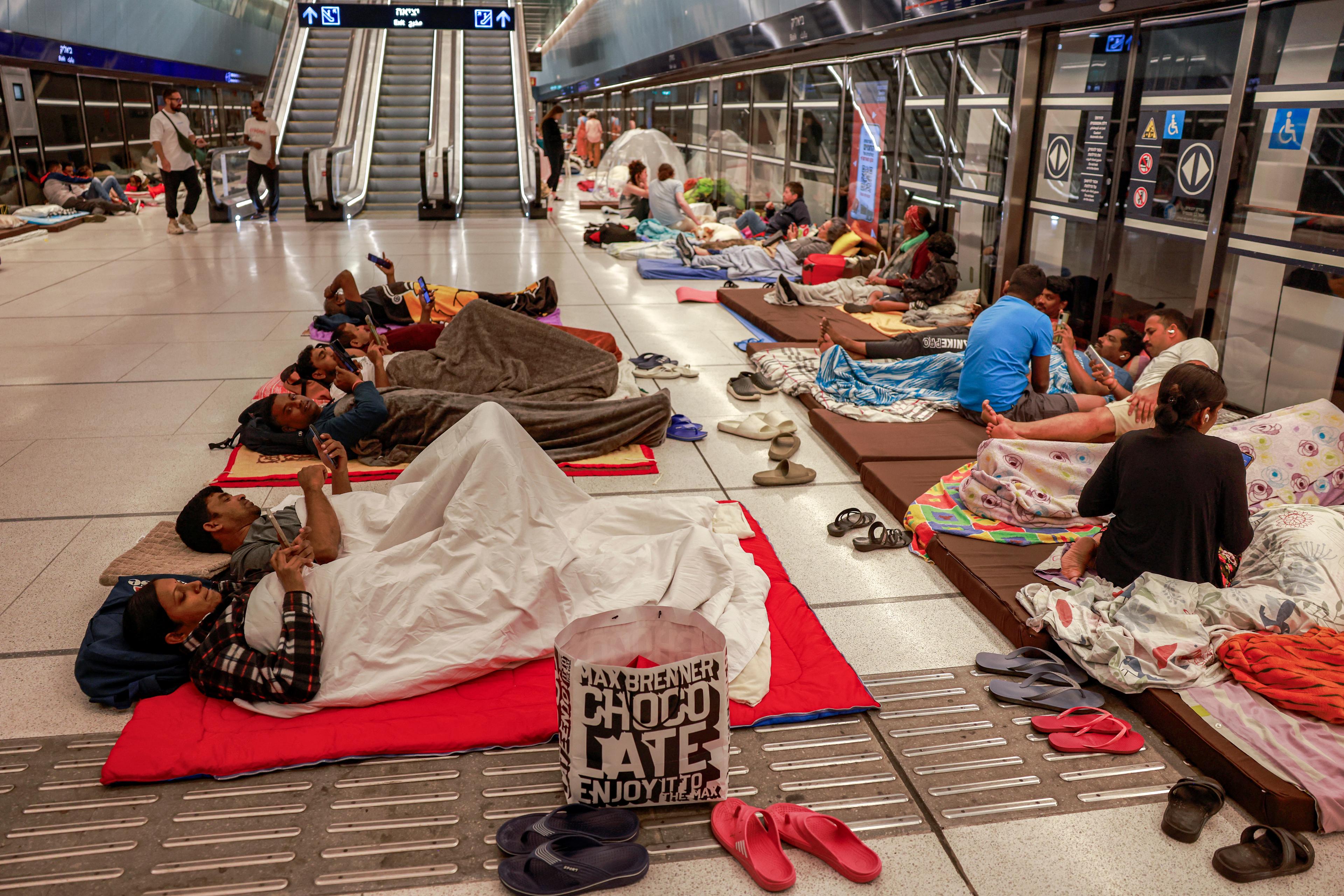 People take shelter for the night at an underground light rail station in the city of Ramat Gan, east of Tel Aviv, on June 17, 2025. (Menahem Kahana/AFP via Getty Images)