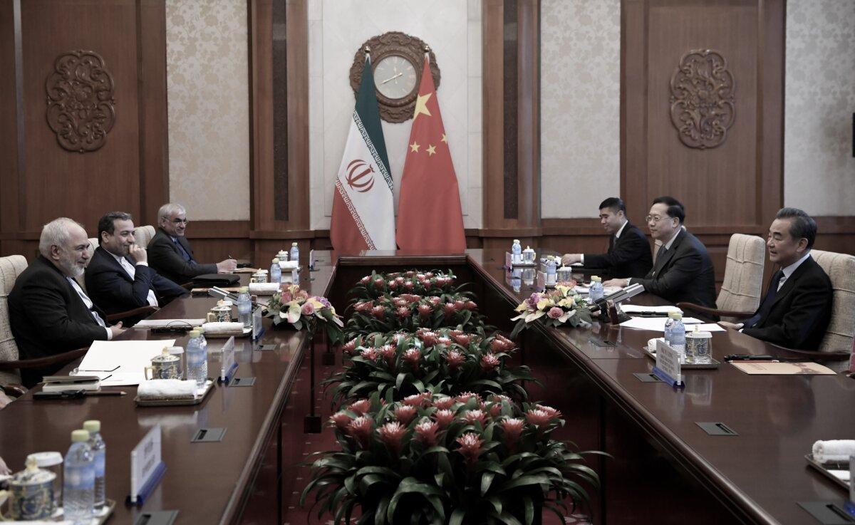 Iranian Foreign Minister Mohammad Javad Zarif (L) talks to Chinese Foreign Minister Wang Yi (R) during their meeting at the Diaoyutai State Guest House in Beijing on Dec. 31, 2019. (Noel Celis / POOL/AFP via Getty Images)