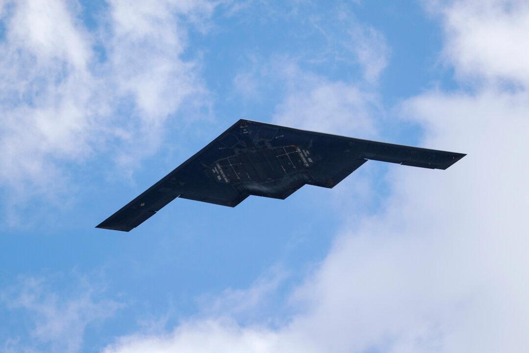 A B-2 Spirit stealth bomber performs a flyover of Barnes-Jewish Hospital in St. Louis on May 8, 2020. (Jeff Roberson, File/AP)