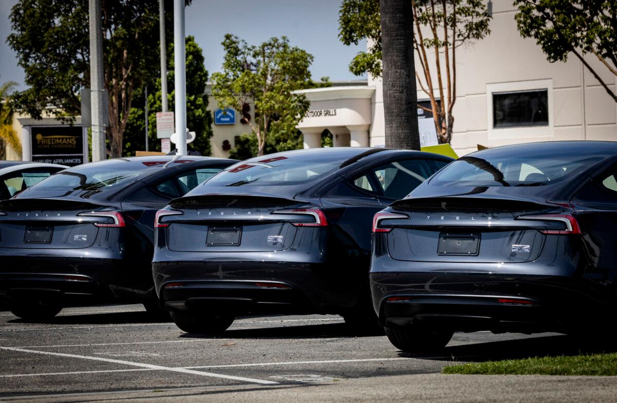 Tesla vehicles sit for sale at a Tesla dealership in Long Beach, Calif., on March 29, 2025. (John Fredricks/The Epoch Times)