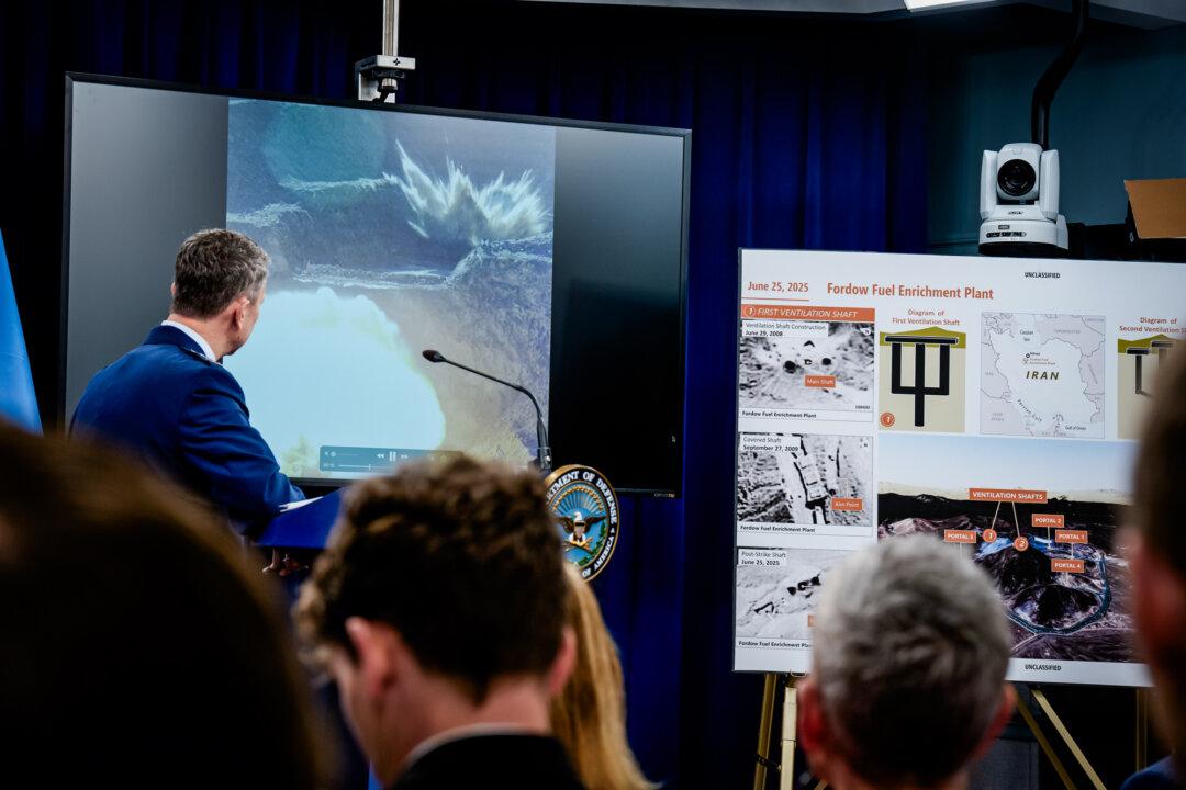 Chairman of the Joint Chiefs of Staff Air Force Gen. Dan Caine watches a video of a bombing test of the GBU-57A/B Massive Ordnance Penetrator (MOP) used in the attack on the Iranian Fordow Fuel Enrichment Plant during a news conference at the Pentagon in Arlington, Va., on June 26, 2025. (Andrew Harnik/Getty Images)