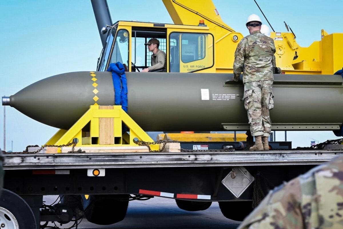 Airmen look at a GBU-57, or Massive Ordnance Penetrator bomb, at Whiteman Air Force Base in Missouri on May 2, 2023. (U.S. Air Force via AP)