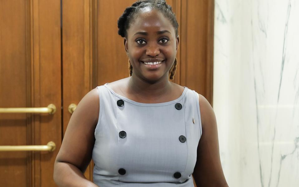 Joy Otuyemi, 23, appears at a naturalization ceremony at the War Memorial in Indianapolis on June 26, 2025. (Lawrence Wilson/The Epoch Times)