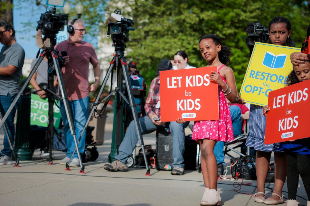 Children and supporters of parents advocating for religious rights demonstrate outside the Supreme Court in Washington on April 22, 2025. Parents won the right to sue to opt their young children out of school storybooks that promote LGBT lifestyles due to religious reasons in a Supreme Court ruling on June 27. (Anna Moneymaker/Getty Images)