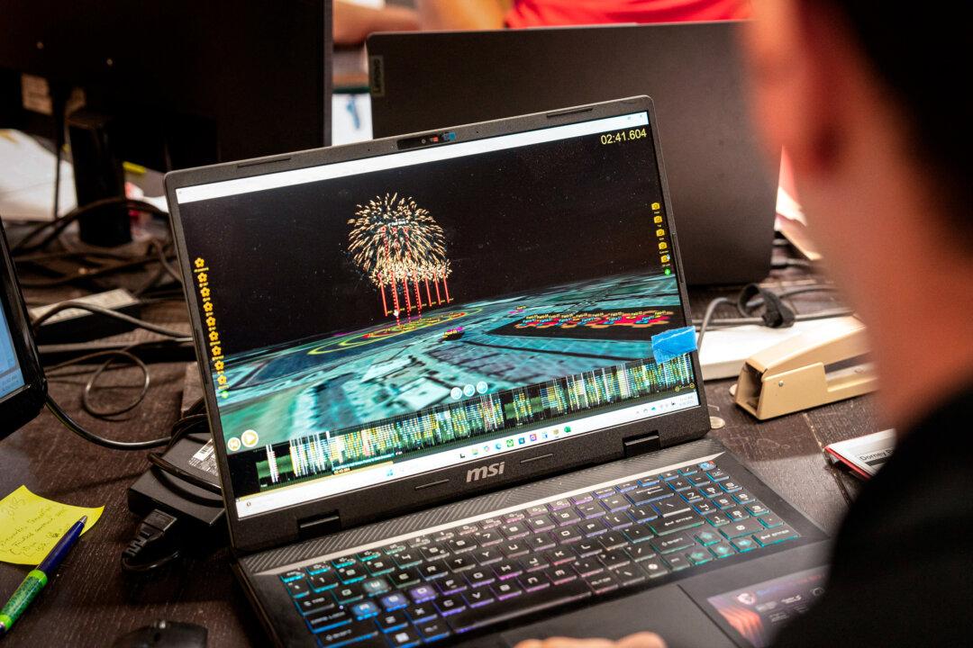 (Top) Tyler Wiesmann, a show designer for Rozzi’s Famous Fireworks, uses a computer to plan shows at the company’s office in Martinsville, Ohio, on June 26, 2025. (Bottom) Wiesmann uses a computer to plan shows at the company’s office in Martinsville, Ohio, on June 26, 2025. (Samira Bouaou/The Epoch Times)