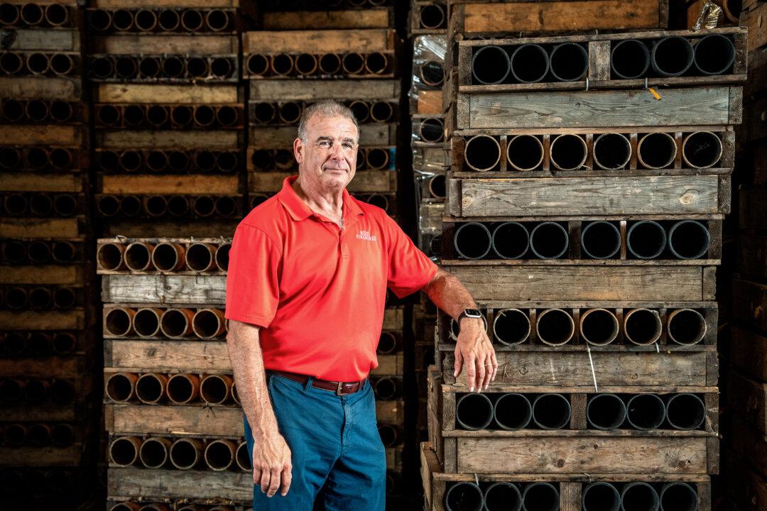 Joe Rozzi, vice president of Rozzi’s Famous Fireworks, stands in front of firework mortars at the company’s show-preparation site in Martinsville, Ohio, on June 26, 2025. Nearly one-third of the company’s annual bookings—about 100 shows—take place on or around Independence Day across the Midwest and Eastern United States. (Samira Bouaou/The Epoch Times)