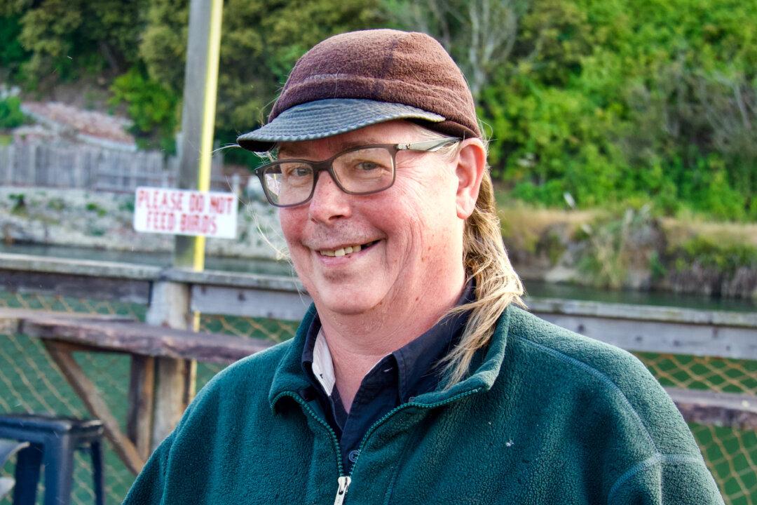 Rush Jones, 56, poses for a photo at the Sea Pal Cove Restaurant at Noyo Harbor in Fort Bragg, Calif., on June 21, 2025. (Travis Gillmore/The Epoch Times)