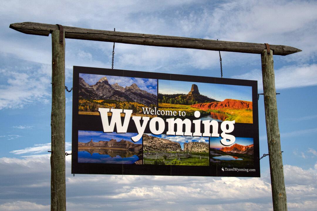 A sign on I-80 East welcomes travelers to Wyoming, as seen on June 23, 2025. (Travis Gillmore/The Epoch Times)