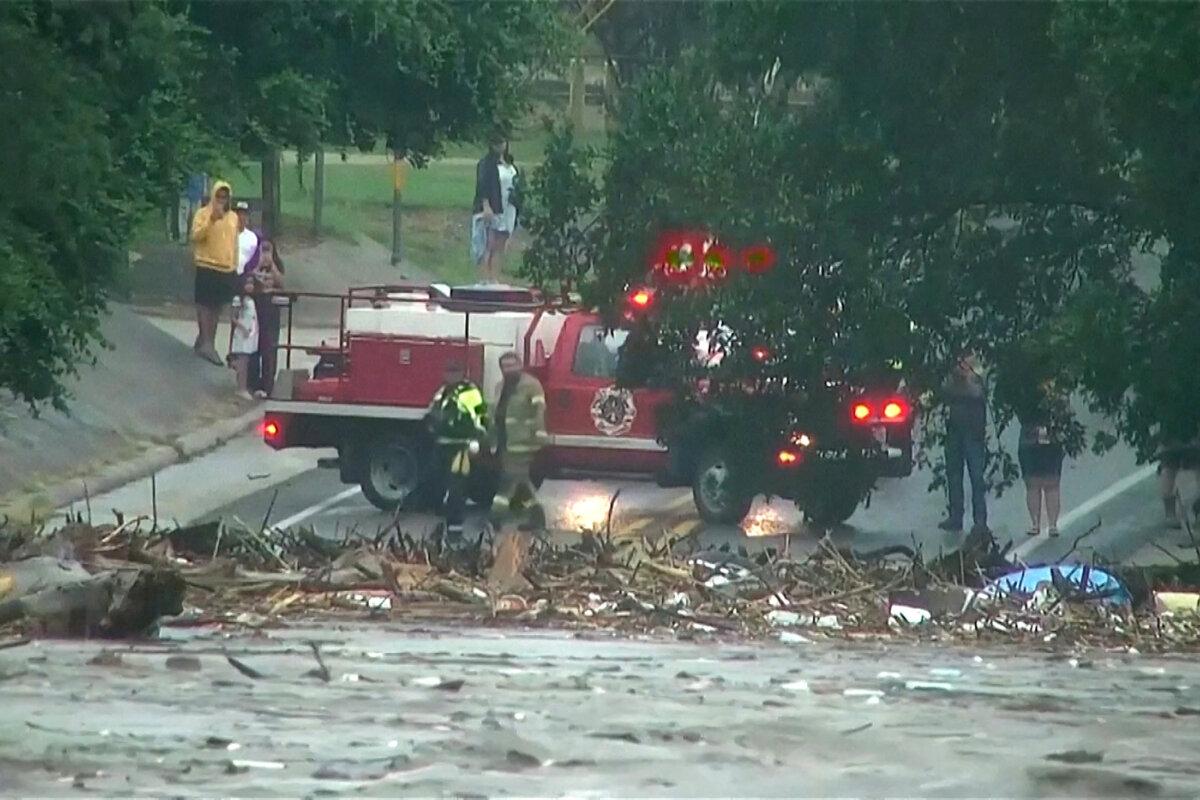First responders survey rising flood waters of the Guadalupe River after flash flooding in Kerr County, Texas, on July 4, 2025. (ABC Affiliate KSAT via Reuters)