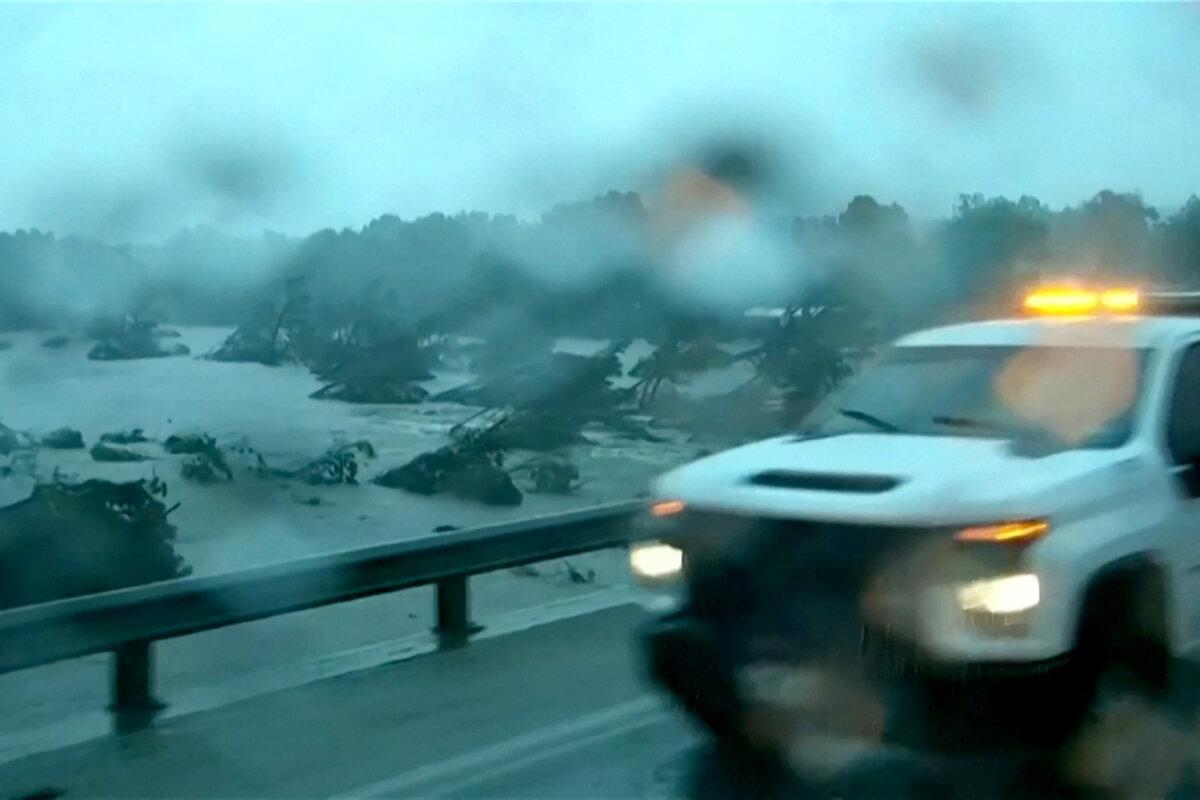 First responders survey rising flood waters of the Guadalupe River after flash flooding in Kerr County, Texas, on July 4, 2025. (ABC Affiliate KSAT via Reuters)