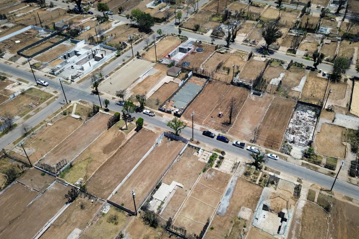 The property lines of homes burned during the Palisades Fire still sit visible in the Pacific Palisades neighborhood of Los Angeles on June 9, 2025. (John Fredricks/The Epoch Times)