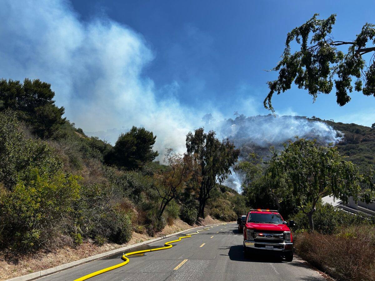 Crews battle a hillside fire allegedly started by fireworks in Laguna Beach, Calif., on July 7, 2025. (Laguna Beach Fire Department)