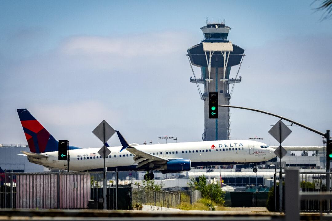 Air traffic controllers monitor planes at Los Angeles International Airport on July 1, 2025. Under the One Big Beautiful Bill Act, the Transportation Department will receive $12.5 billion to implement long-overdue reforms to the U.S. air traffic control system. (John Fredricks/The Epoch Times)