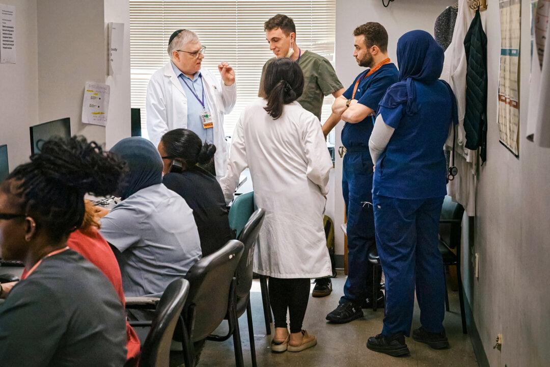 Resident doctors talk with a senior doctor inside Brookdale University Hospital and Medical Center in the Brooklyn borough of New York City on July 1, 2025. (Andres Kudacki/AP Photo)