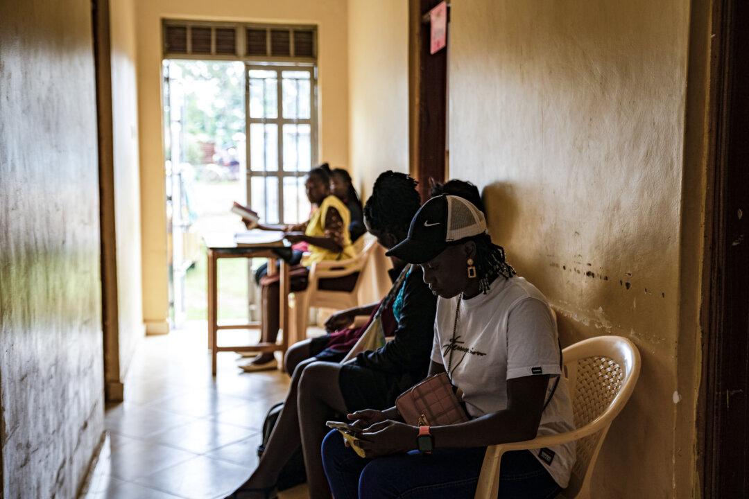 Patients wait in the corridor of Kuoyo Sub-county Hospital in Kisumu, a facility once supported by USAID, in Kenya on April 24, 2025. Kisumu has one of the highest HIV rates in Kenya, with about 17.6 percent of the adult population living with the virus—nearly five times the national average. (Michel Lunanga/Getty Images)