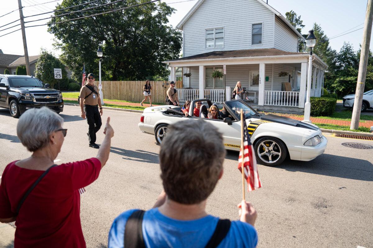 Helen Comperatore and daughters Allyson and Kaylee take part in a parade in memory of Corey Comperatore, near Butler, Pa., on July 12, 2025. (Samira Bouaou/The Epoch Times)