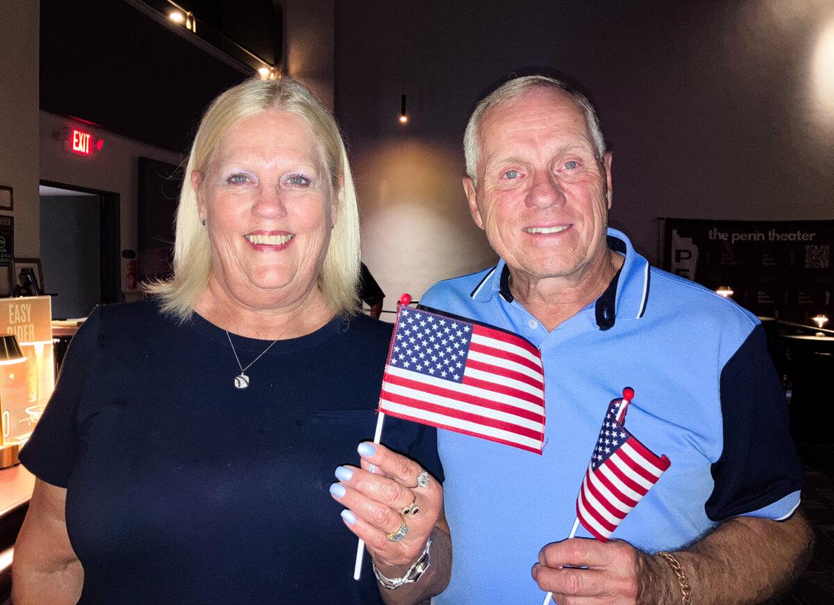 Gail Paserba, a board member of The Penn Theater, and Dave Zirnsak were among the community members who attended a movie screening to raise money for the Corey Comperatore Foundation in Butler, Pa., on July 11, 2025. (Janice Hisle/The Epoch Times)