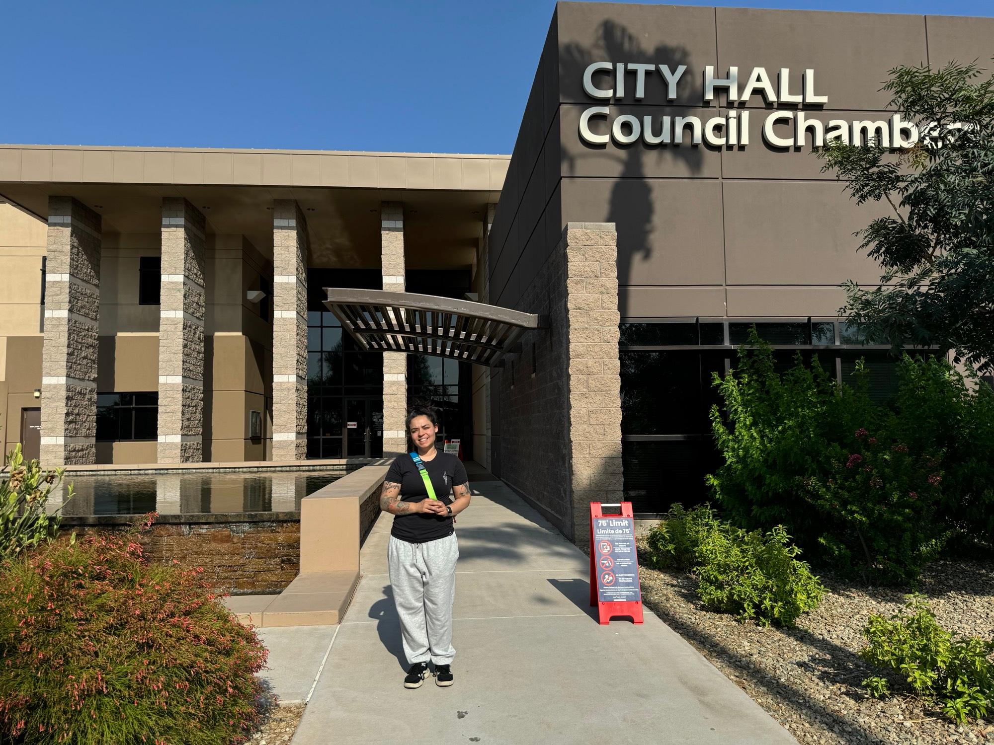 Danielle Wellborn, a voter in Maricopa County, stands outside Avondale City Hall after dropping off the mail-in ballots for herself and her children on July 14, 2025. (Arjun Singh/The Epoch Times)