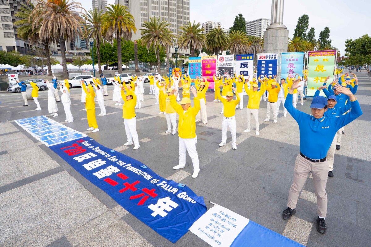 Practitioners do the Falun Gong exercises before a parade in San Francisco on July 12, 2025. (Gary Wang/The Epoch Times)