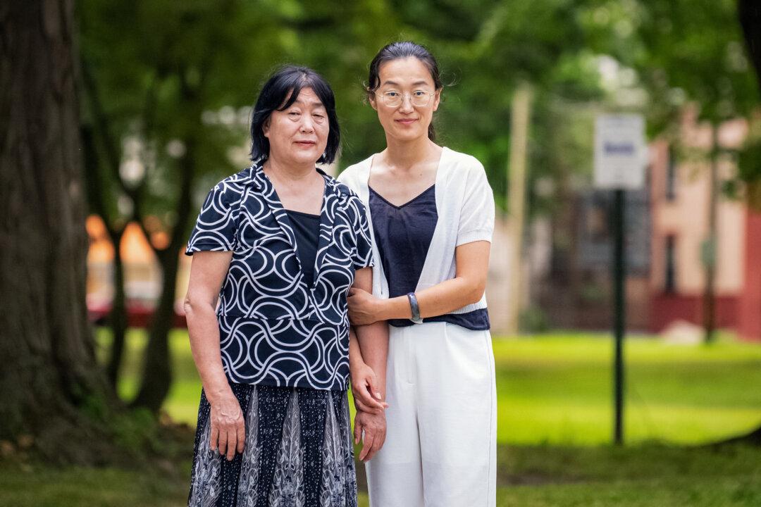Shi Baohua and her daughter Qin Lili in New York on July 14, 2025. Shi had been arrested five times since the Chinese Communist Party launched the persecution of Falun Gong in 1999. (Larry Dye/The Epoch Times)