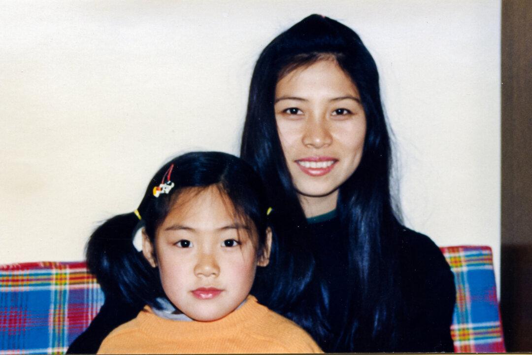 Liu Ziyu with her aunt, Gao Rongrong, in Liaoning Province, China, in 1994. At the Longshan Forced Labor Camp in 2004, a guard shocked Gao in the face with an electric baton for more than seven hours, until it was burned and disfigured. She died in police custody in June 2005. (Courtesy of Liu Ziyu)