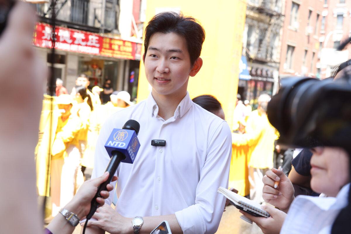 Shen Yun Performing Arts dancer Ethan Guo joins a march to call for the end of the Chinese Communist Party's 26 years of ongoing persecution against Falun Gong, in New York City on July 20, 2025. (Benny Zhang/The Epoch Times)