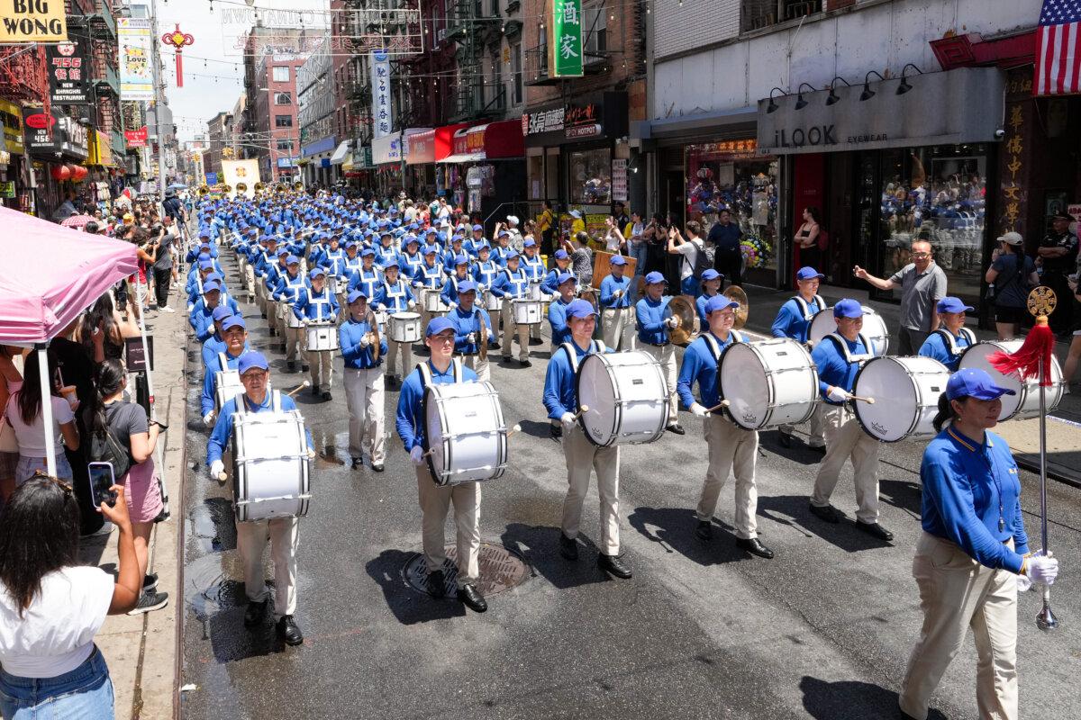 The Tianguo marching band participates in a parade calling for an end to the Chinese Communist Party’s 26-year-long persecution against the spiritual practice, in New York City on July 20, 2025. (Larry Dye/The Epoch Times)