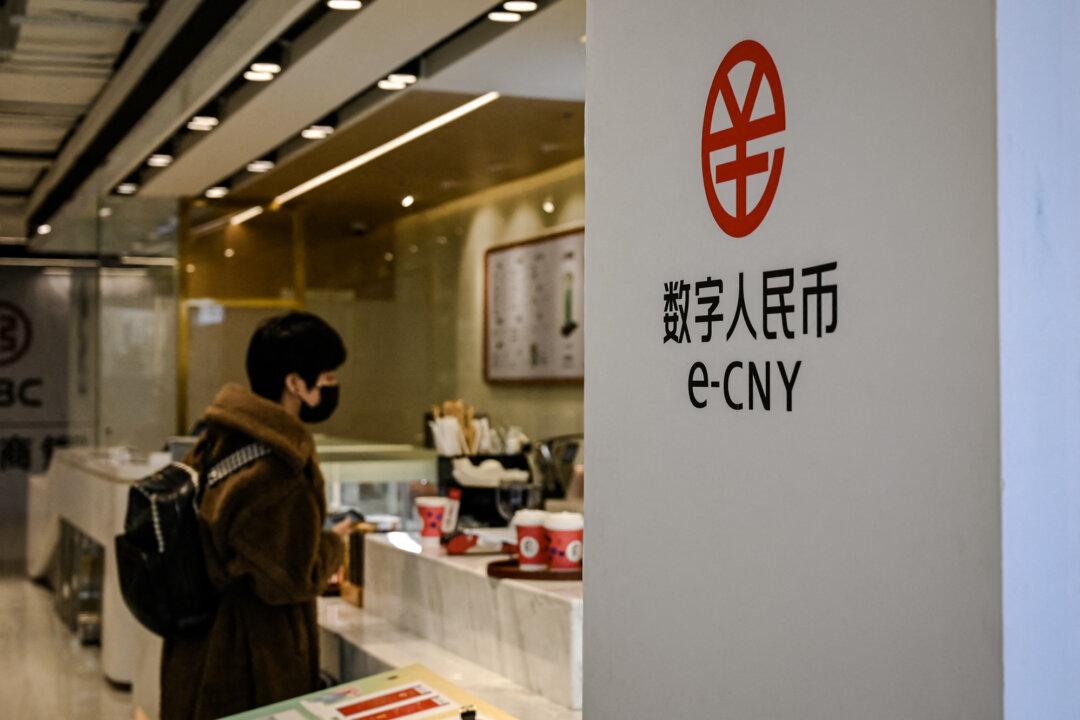 Signage of the Chinese digital currency is seen near a coffee store in the New Actuation Fintech Center in Beijing on Feb. 17, 2022. (Jade Gao/AFP via Getty Images)