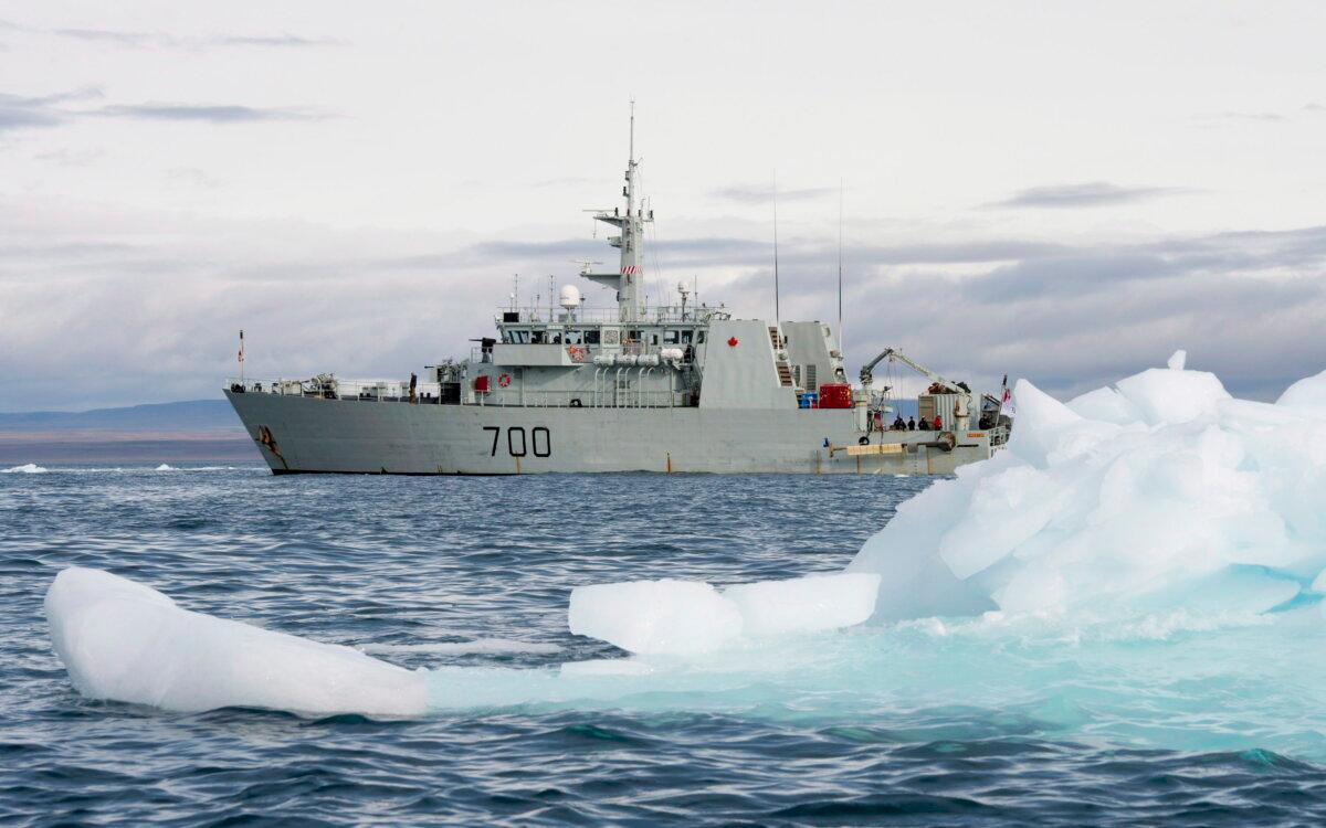 Ice floats past HMCS Kingston west of Pond Inlet in the Canadian Arctic, in a file photo. (The Canadian Press/Adrian Wyld)