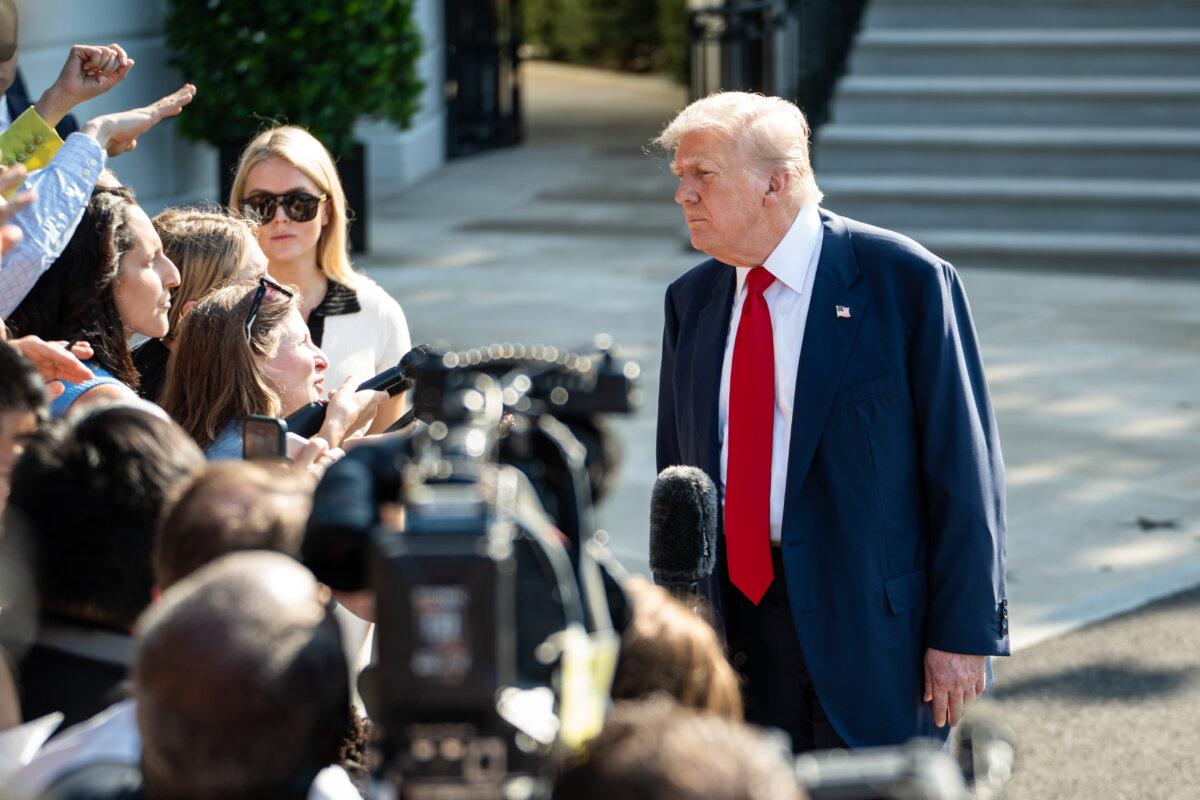 President Donald Trump speaks to the press before departing for Scotland from the White House on July 25, 2025. (Madalina Kilroy/The Epoch Times)