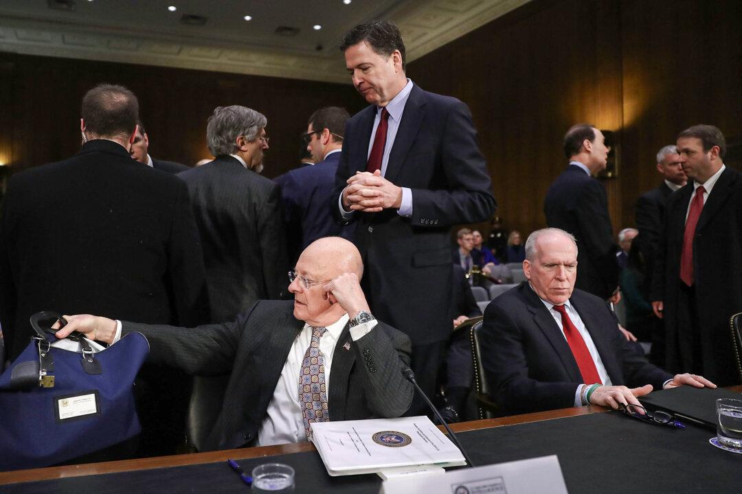 Director of National Intelligence James Clapper (L), FBI Director James Comey (C), and CIA Director John Brennan wait to testify before the Senate Intelligence Committee on Capitol Hill in Washington on Jan. 10, 2017. (Joe Raedle/Getty Images)
