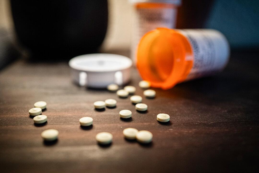 Pain pills sit on a table outside Los Angeles on June 4, 2025. Alexander Neville died of a fentanyl overdose after taking what he believed was OxyContin, purchased from a dealer on Snapchat. (John Fredricks/The Epoch Times)