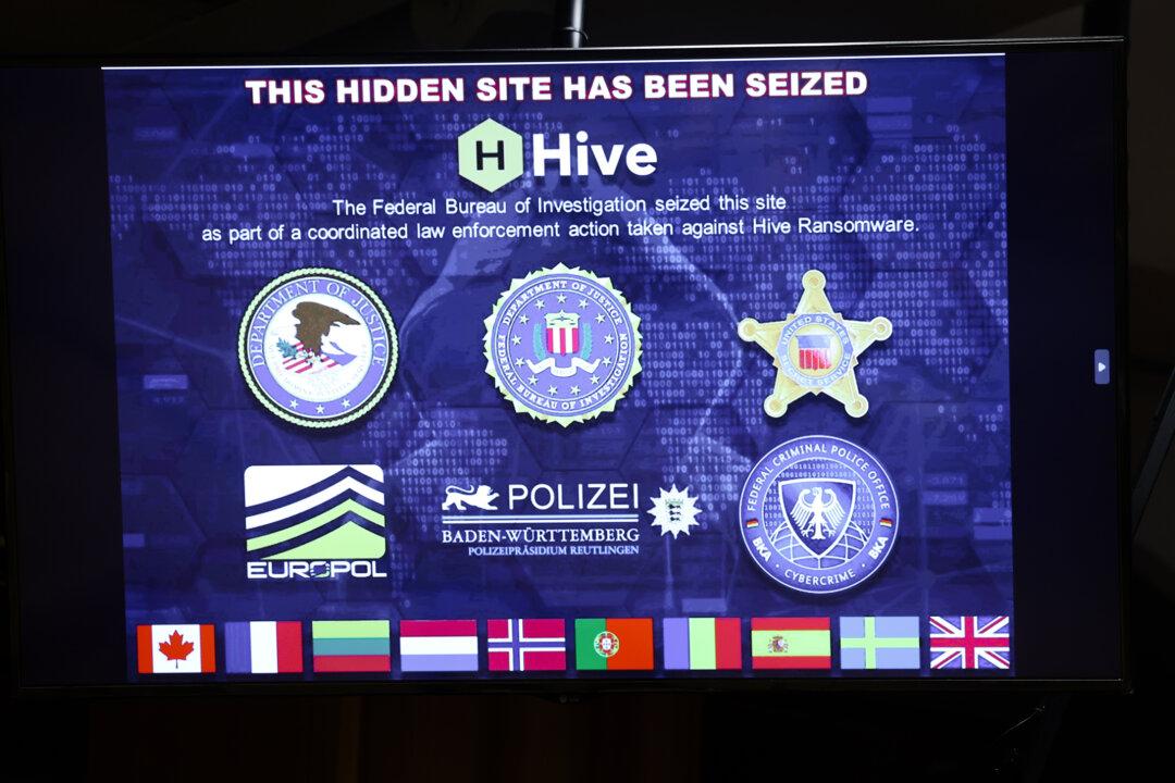 An image of a seized ransomware website is displayed during a Justice Department news conference in Washington on Jan. 26, 2023. As artificial intelligence is increasingly used to support cyberattacks, some officials are seeking to curb the crime by limiting ransom payments, which they say fuel cybercrime. (Kevin Dietsch/Getty Images)