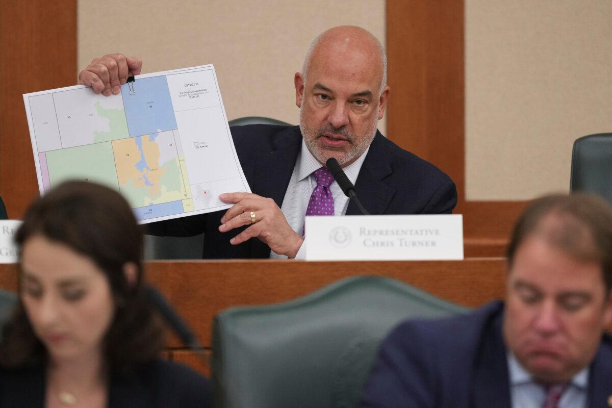 Texas state Rep. Chris Turner holds a map during a public hearing on congressional redistricting in Austin, Texas, on Aug. 1, 2025. (Eric Gay/AP Photo)