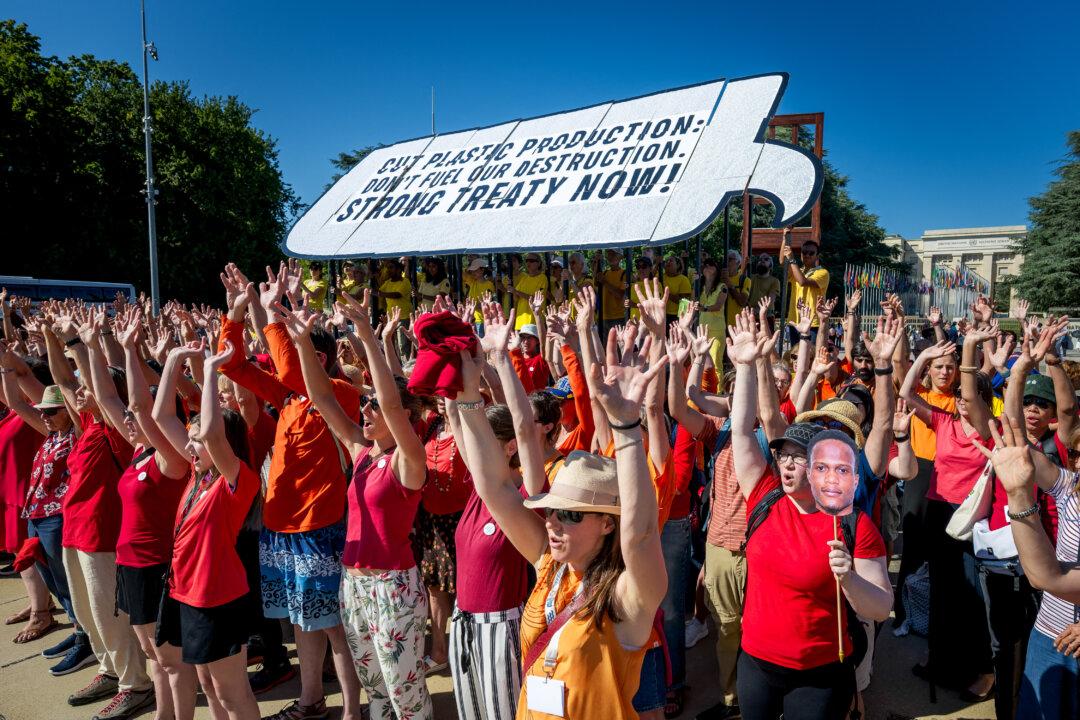 Activists stage a demonstration in front of the United Nations Offices in Geneva, Switzerland, on the eve of the Plastics Treaty negotiations, on Aug. 4, 2025. Negotiators will try again to reach a global pact on plastic pollution at talks from Aug. 5–14, but they face deep divisions over how to tackle the health and ecological hazard. (Fabrice Coffrini/AFP via Getty Images)