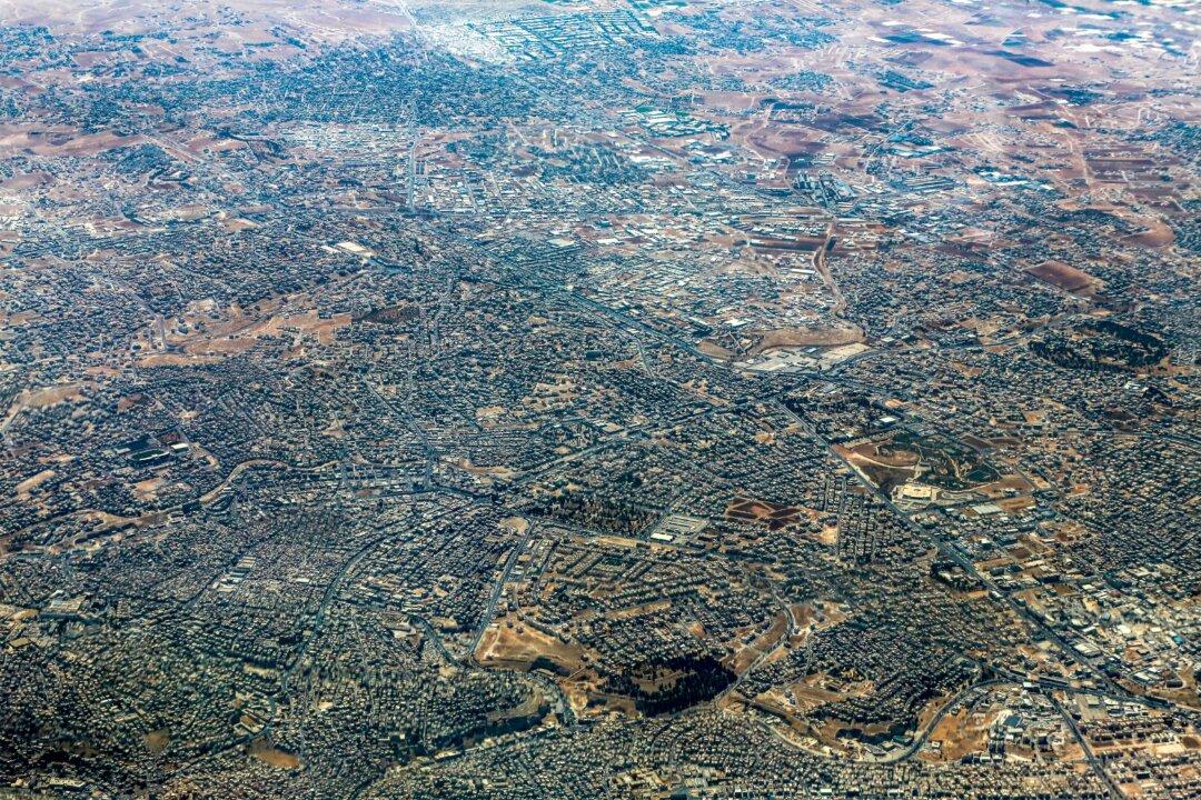An aerial view shot from a German Air Force (Luftwaffe) military transport aircraft during an airdrop relief mission shows the scene in the Gaza Strip on Aug. 5, 2025. (Khalil Mazraawi/AFP via Getty Images)