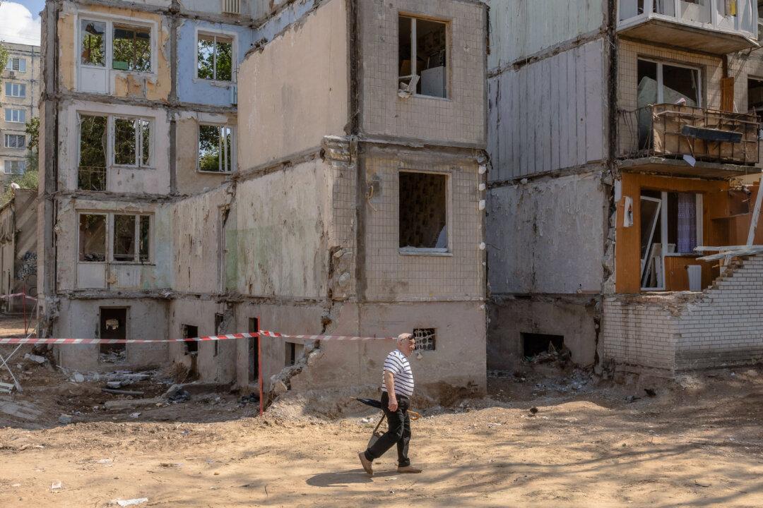 A man walks past a nine-story residential building destroyed following a recent Russian missile strike in Kyiv, on Aug. 5, 2025, amid the Russian invasion of Ukraine. (Roman Pilipey/AFP via Getty Images)