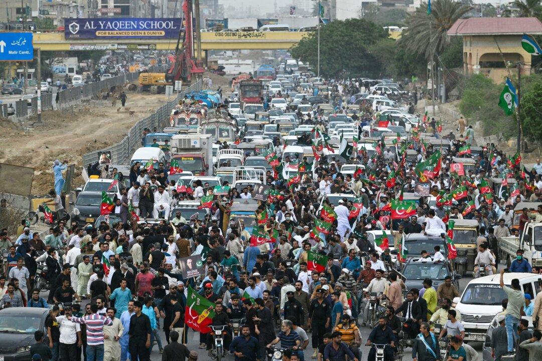 Supporters of Pakistan Tehreek-e-Insaf march during a protest demanding the release of jailed former Prime Minister Imran Khan in Karachi, on Aug. 5, 2025. (Asif Hassan/AFP via Getty Images)